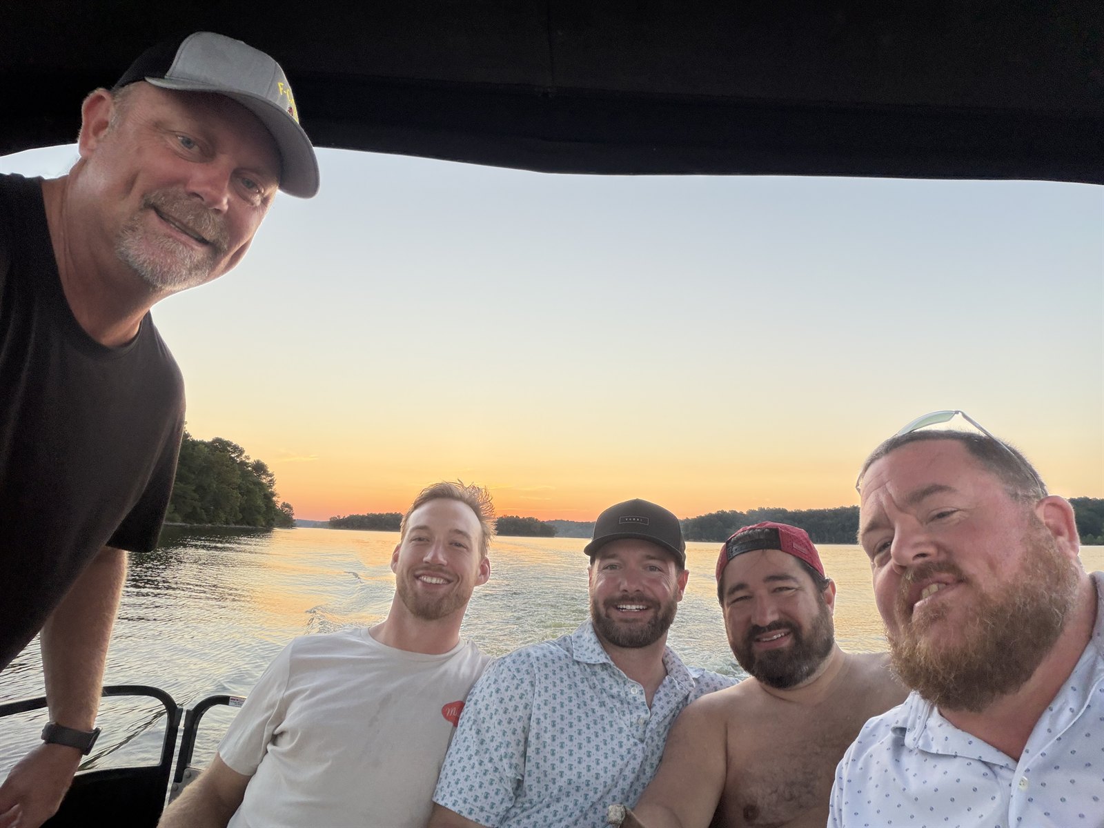 Highland team on the lake at sunset